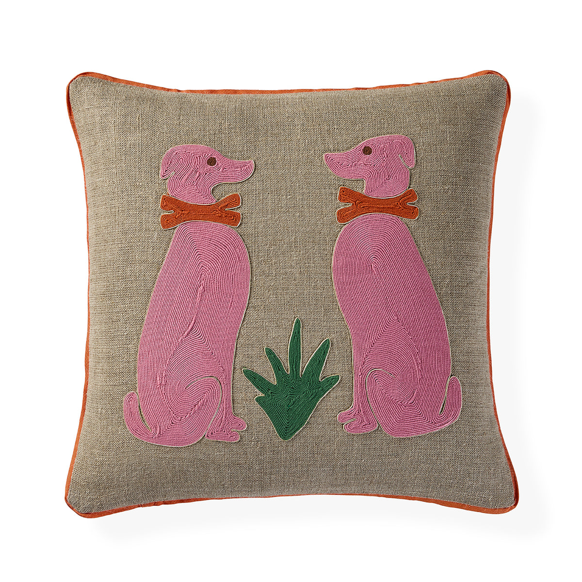 A square beige linen throw pillow with orange piping, featuring an embroidered design of two pink dogs wearing orange collars and a green plant in the center.