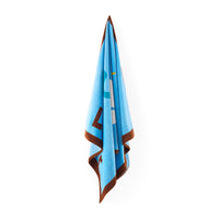 Light blue towel with brown border on a white background