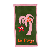 Green beach towel with pink palm tree and red star design, featuring 'La Plage' text.