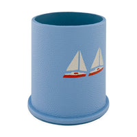 Blue textured cup with sailboat design on a white background