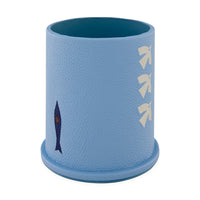 Blue textured cup with fish design on a white background