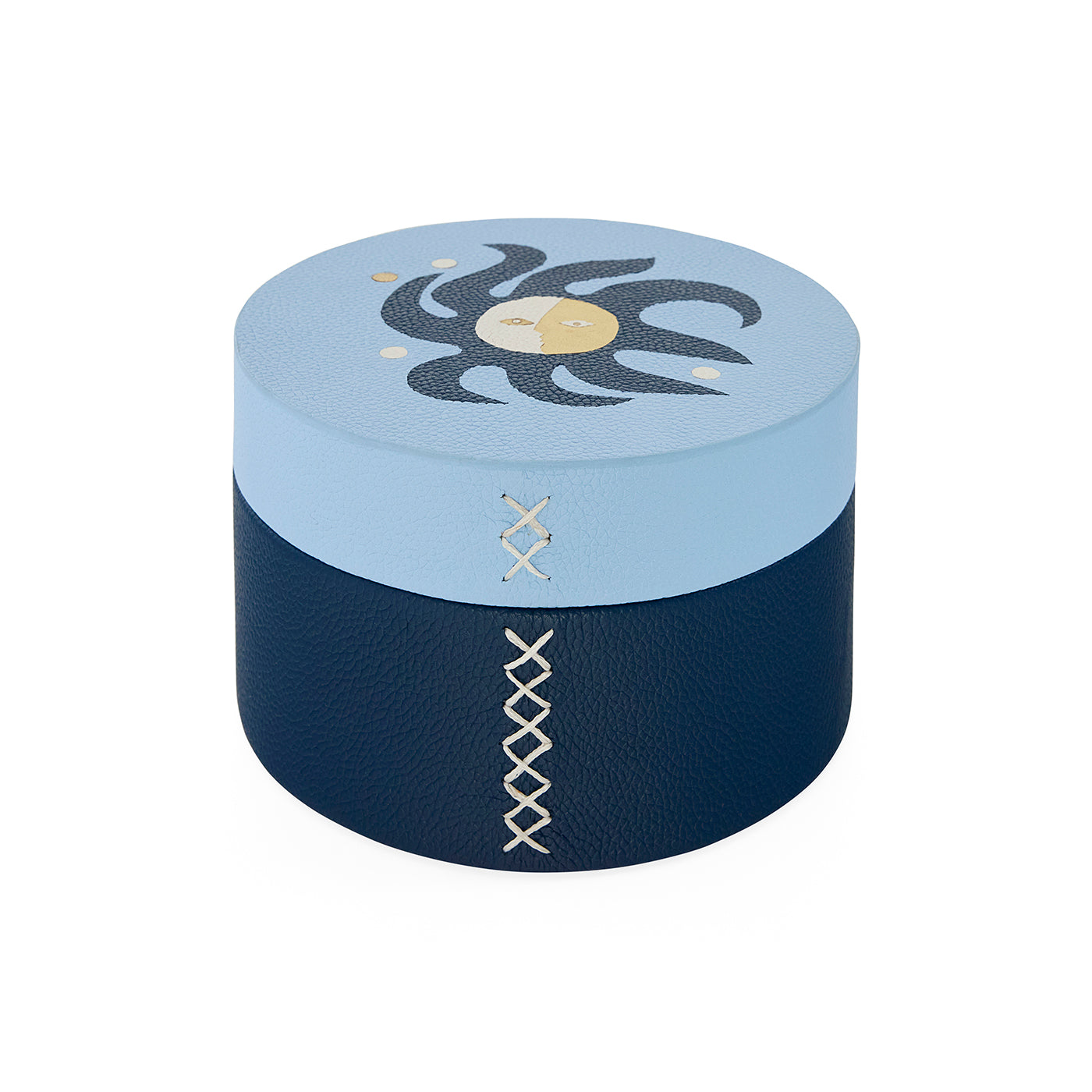 Round blue and navy box with decorative patterns on a white background