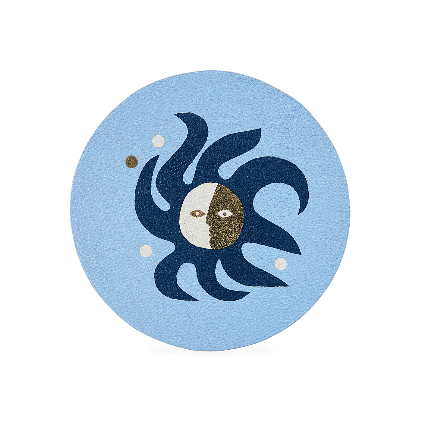 Decorative coaster with sun and moon design on a light blue background