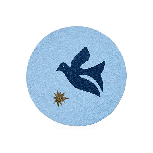 Round light blue coaster with a dark blue dove and gold star design on a white background