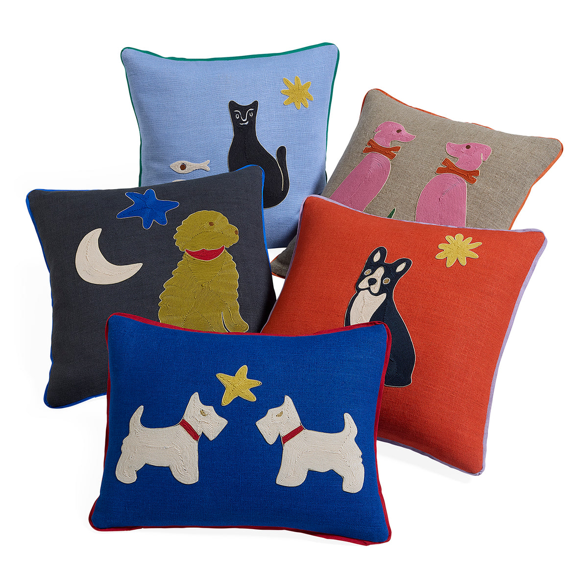 Five decorative throw pillows arranged together on a white background, each with a different animal and star/moon motif in contrasting colors.