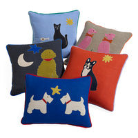 Five decorative throw pillows arranged together on a white background, each with a different animal and star/moon motif in contrasting colors.