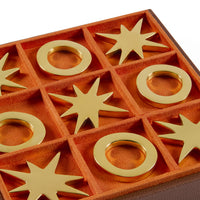 Decorative items with gold rings and star shapes on a red background