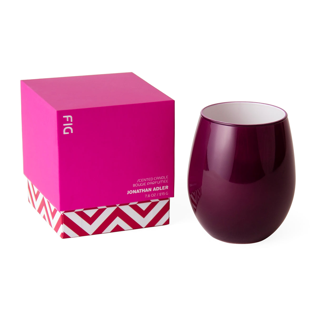 Jonathan Adler Fig Scented Candle in a glossy deep burgundy stemless glass cup, shown next to its hot pink and white patterned packaging box on a white background.