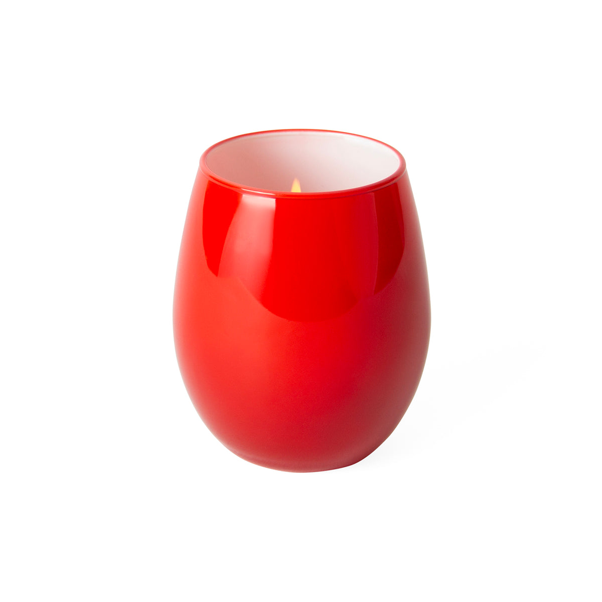 A glossy red stemless wine glass candle holder with a lit candle inside, set against a plain white background.