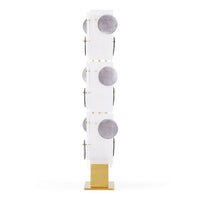 Decorative wall piece with circular designs on a white background