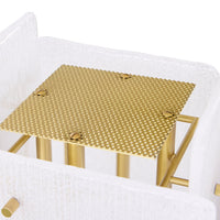 Gold metal table with textured surface on a white background