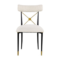Decorative chair with white cushioned seat and backrest, black legs, and gold accents on a white background