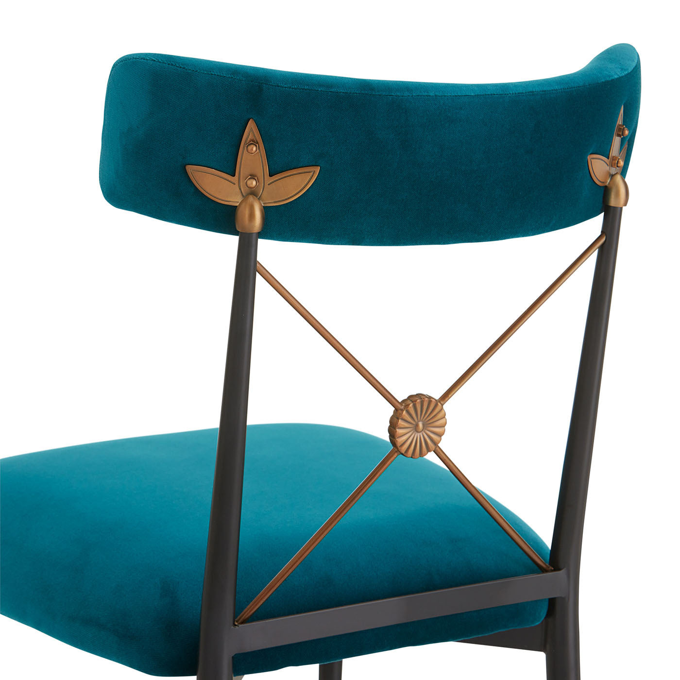 Teal chair with decorative backrest and seat on a white background
