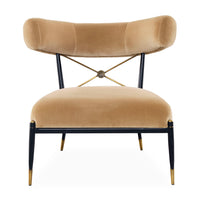 Beige velvet chair with black metal legs and gold accents on a white background