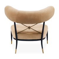 Beige armchair with black metal frame and gold accents on a white background