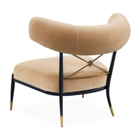 Beige chair with black metal frame and gold accents on a white background