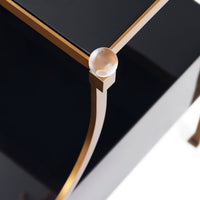 Close-up of a black and gold corner piece with a reflective surface