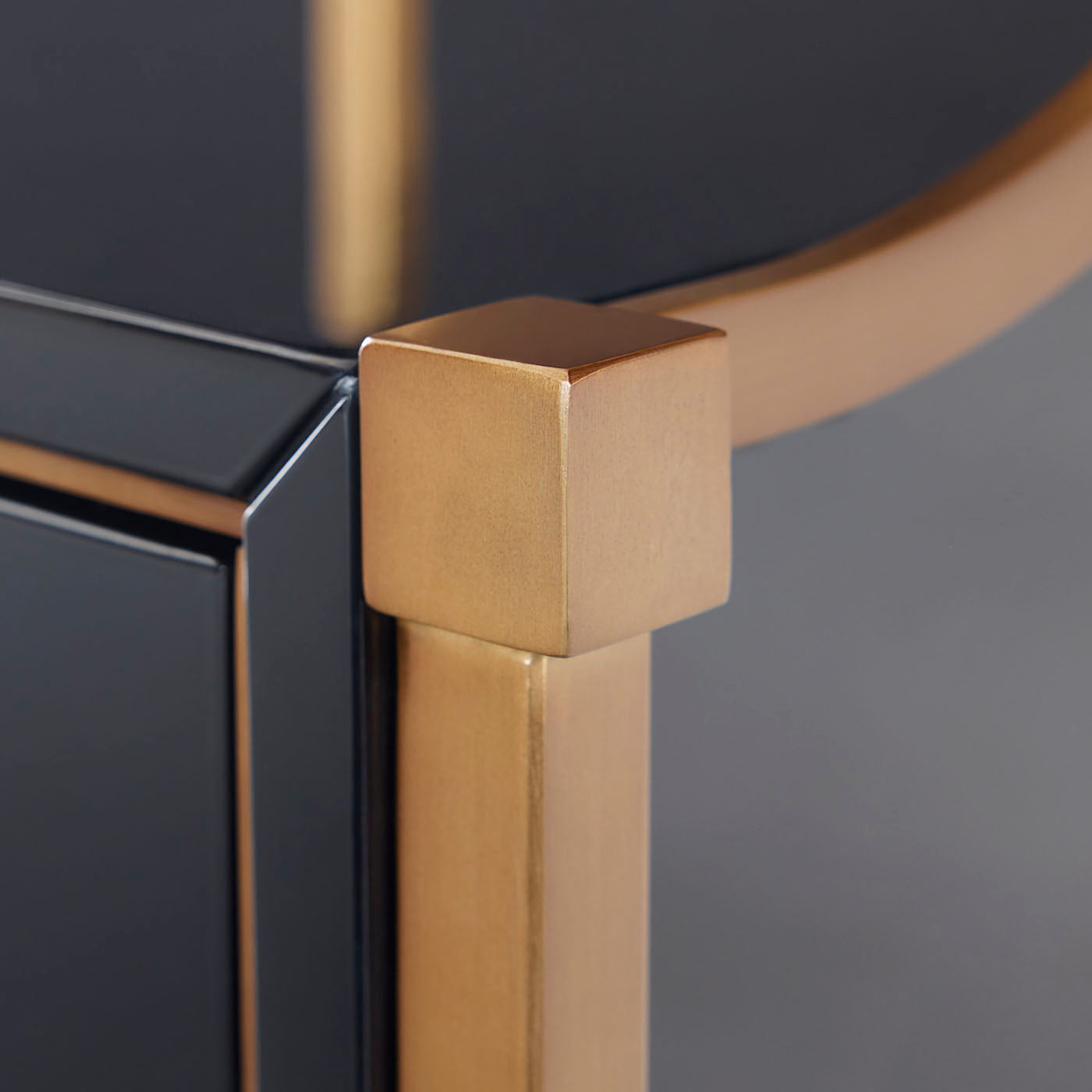 Close-up of a gold metal frame with a black background