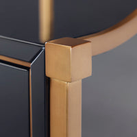 Close-up of a gold metal frame with a black background