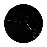 Round black marble coaster with white veins on a white background