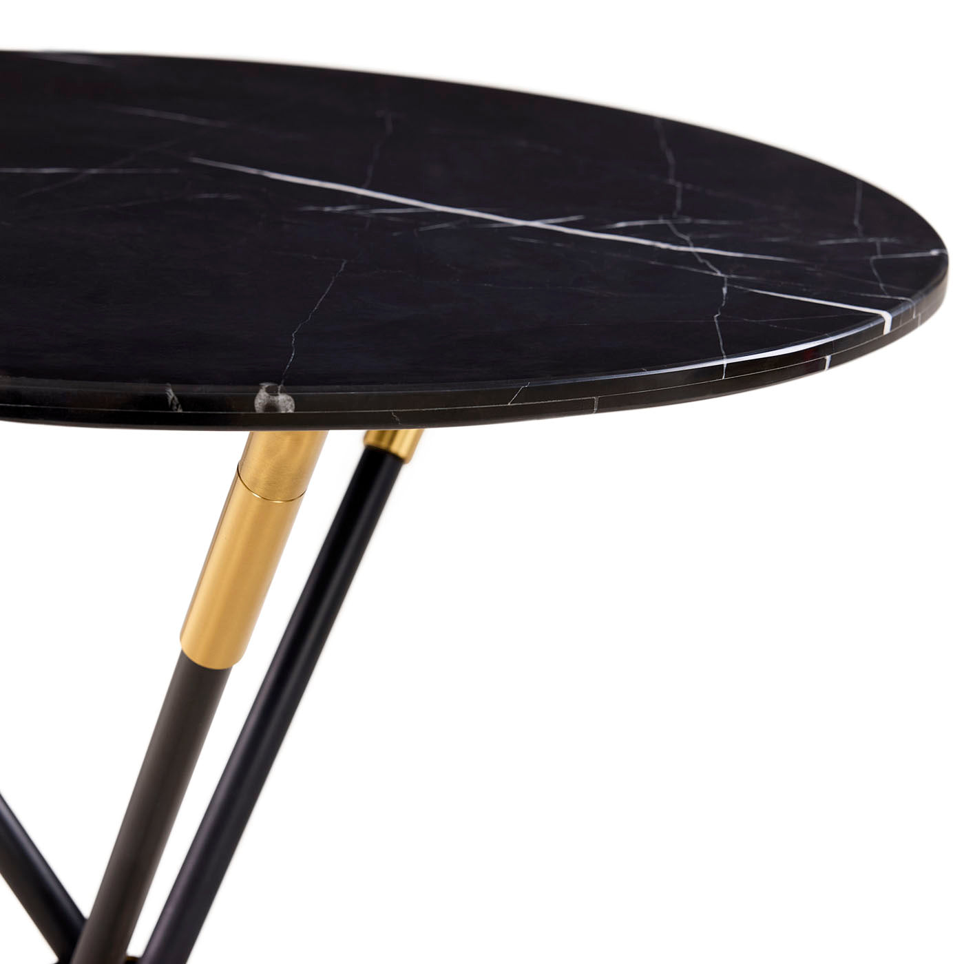Round black marble table with gold accents on a white background