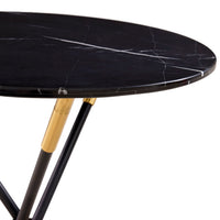 Round black marble table with gold accents on a white background