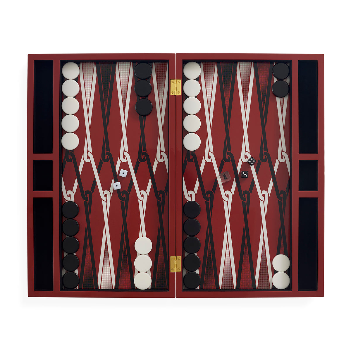 An open backgammon set with a deep red and black checkered board, white and black round tokens, dice, and gold-tone hinges, photographed against a plain white background.
