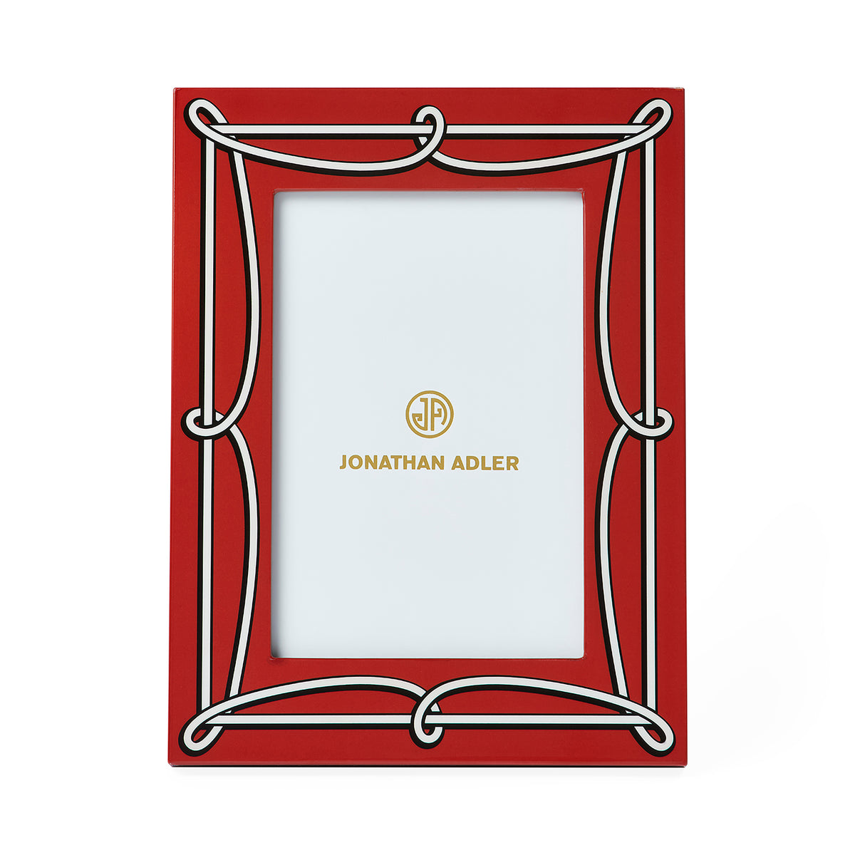 A red picture frame with a white decorative border and gold Jonathan Adler branding printed on the insert, shown against a plain white background.