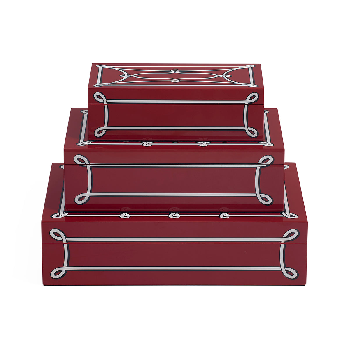 Three nested rectangular storage boxes in glossy deep red with white decorative scrollwork and oval accents on a plain white background.