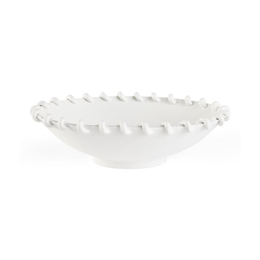 White ceramic bowl with textured rim on a white background