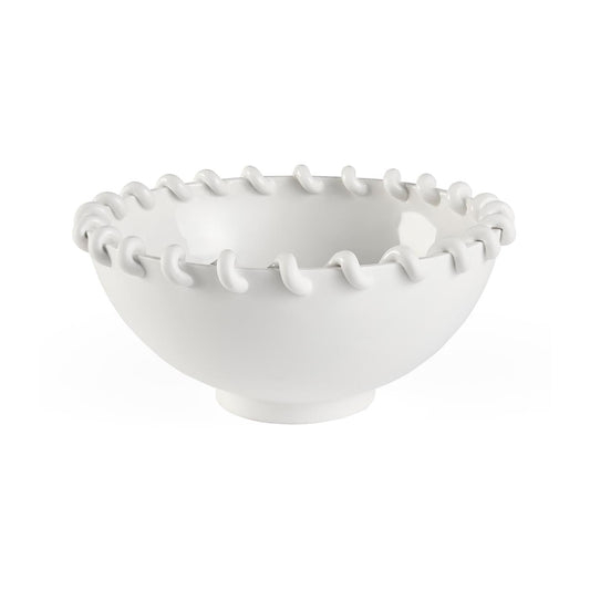 White ceramic bowl with decorative rim on a white background