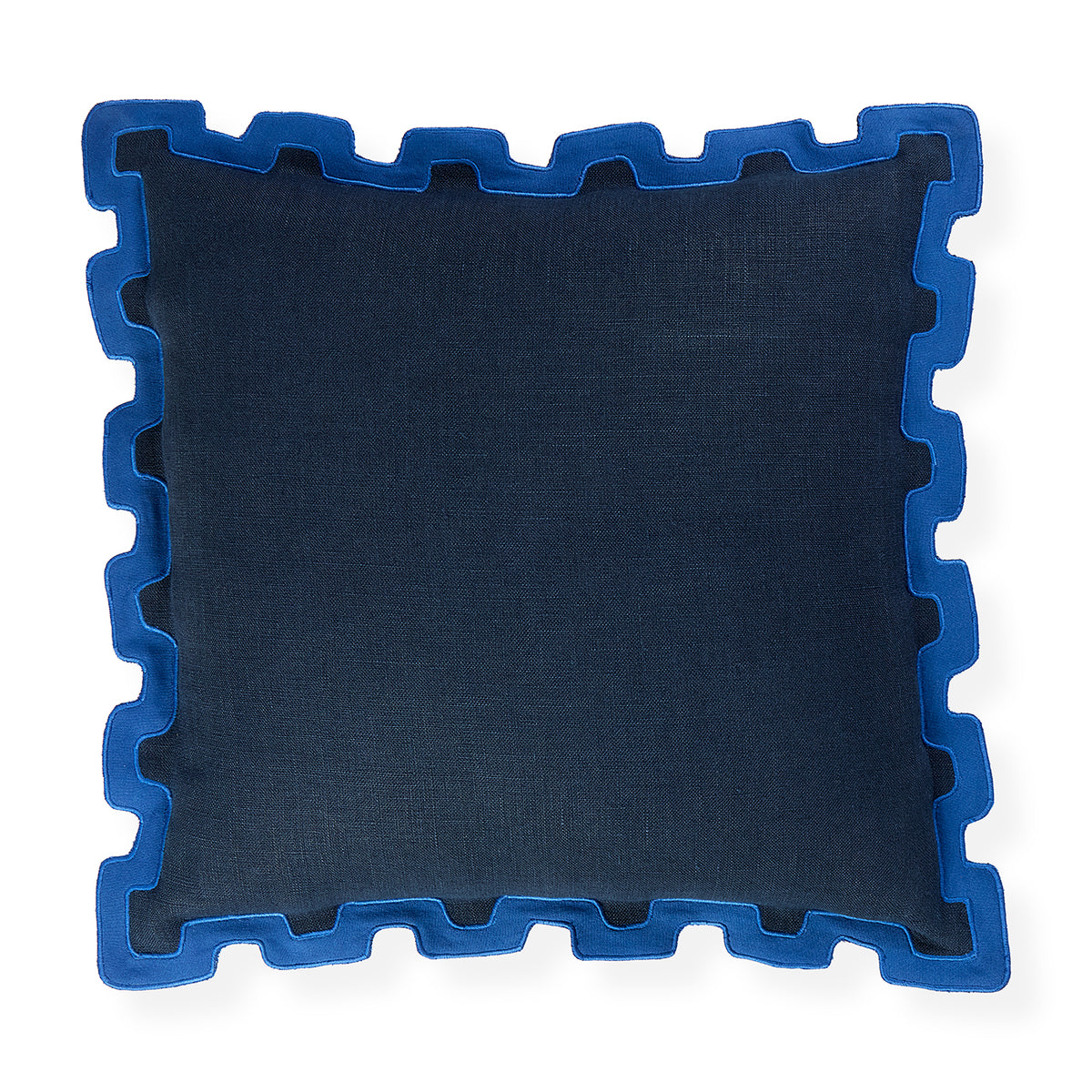 A square throw pillow in dark navy blue fabric with a contrasting bright blue jigsaw puzzle-edge border, shown on a plain white background.