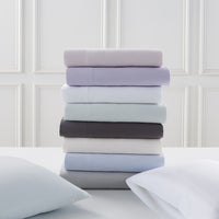sateen sheet set stacked - styled view