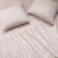 sateen sheet set blush - styled view