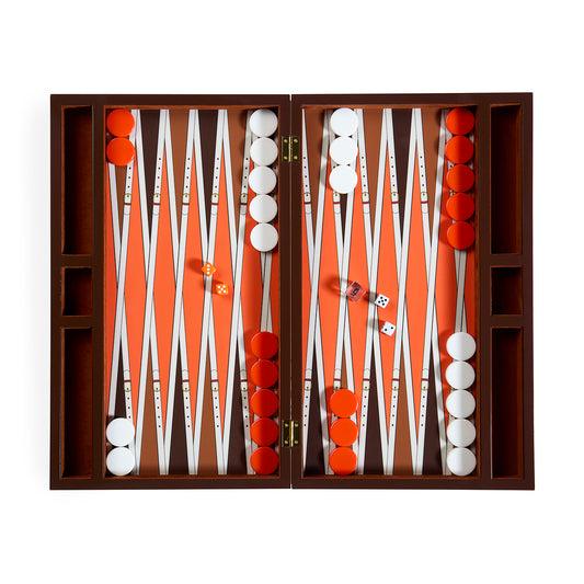 An open wooden backgammon board set with orange playing field, white and red checkers, and dice, photographed from above on a white background.