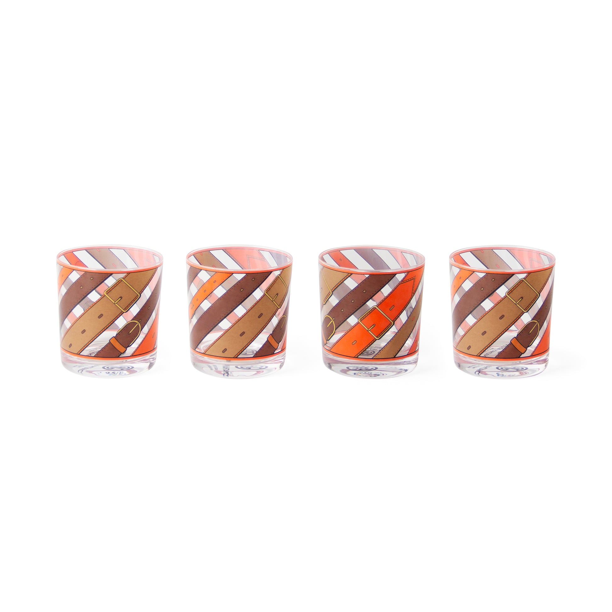 Four clear glass tumblers with a diagonal striped pattern in orange, brown, and white, arranged in a row on a white background.