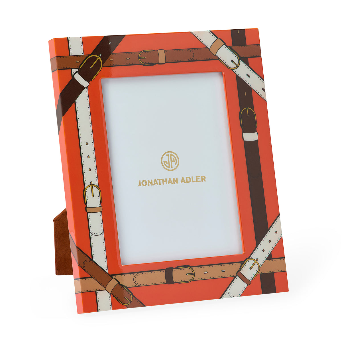 Jonathan Adler picture frame with a bright orange background and an all-over brown and cream leather-buckle print, shown standing on a small matching base against a white background.
