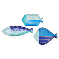 Three fish-shaped decorative plates with blue and gold patterns on a white background