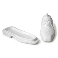 White ceramic shoe and slippers on a white background