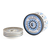 Set of Jonathan Adler Soleil porcelain coasters on a white background