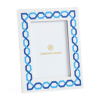 Decorative picture frame with blue and white geometric pattern on a white background, featuring the Jonathan Adler logo.