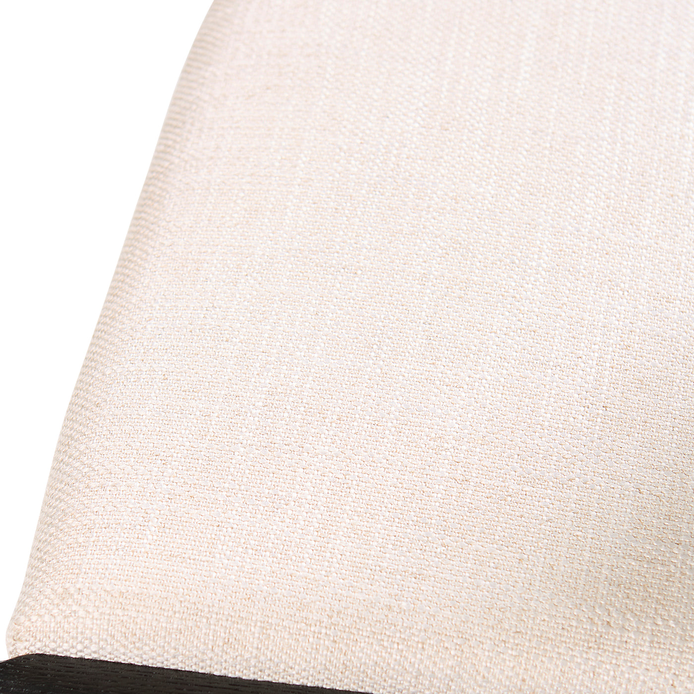 Close-up of a textured beige fabric with a subtle pattern on a white background