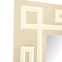 Close-up of a decorative wall mirror frame with a textured beige linen-like background and raised white geometric border details, showing part of the reflective mirror surface.