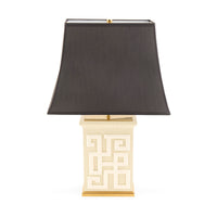 Table lamp with a black shade and decorative base on a white background