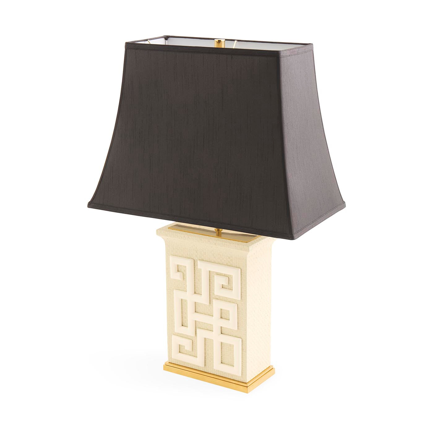 Table lamp with a black shade and decorative white base on a white background