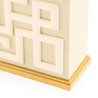 Decorative wall art with geometric pattern and gold frame on a white background