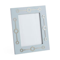 Light blue picture frame with geometric patterns on a white background