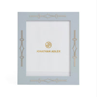 Decorative photo frame with 'Jonathan Adler' branding on a white background