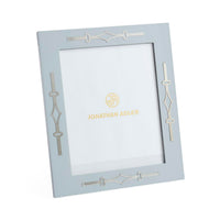 Light blue picture frame with decorative elements and 'Jonathan Adler' branding on a white background