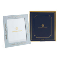 Two Jonathan Adler frames, one light blue and one navy, on a white background.